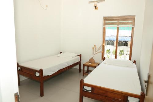 Katil atau katil-katil dalam bilik di Viceroy Inn Homestay