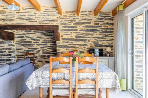 a dining room with a table and chairs at Maison de vacances 4 pers in Saint-Just