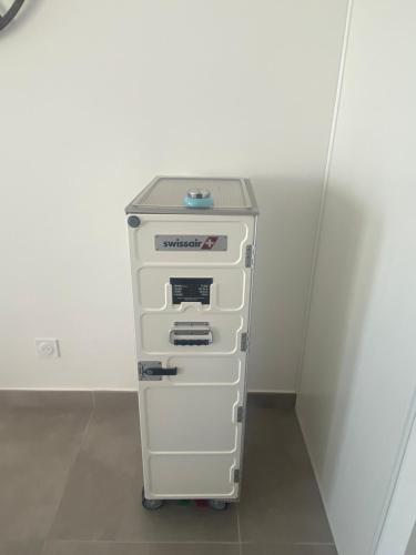 a filing cabinet in a room next to a wall at un endroit de rêve in Marseillan