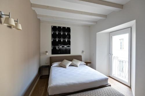 Postel nebo postele na pokoji v ubytování Palazzo 7 Centro Storico NO Pet Friendly Apartment