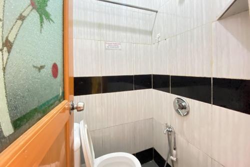 a bathroom with a toilet and a shower at Jeje Kost RedPartner in Nagoya