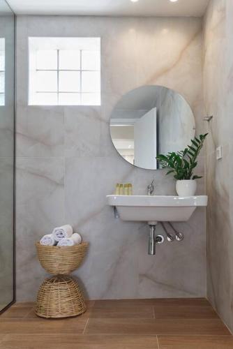 a bathroom with a sink and a mirror at New Crete apartment in Stavromenos Coast w/pool in Stavromenos