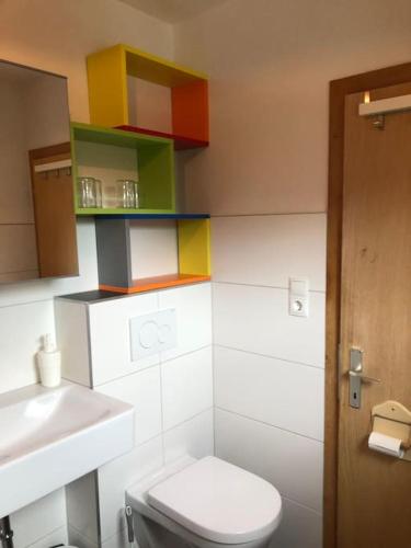 a bathroom with a toilet and a sink at Villa Alberto - gemütliches Häuschen in Ötztal-Bahnhof