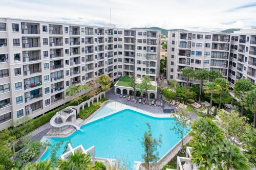 an aerial view of an apartment complex with a swimming pool at Lacasita Penthouse Nap in Hua Hin
