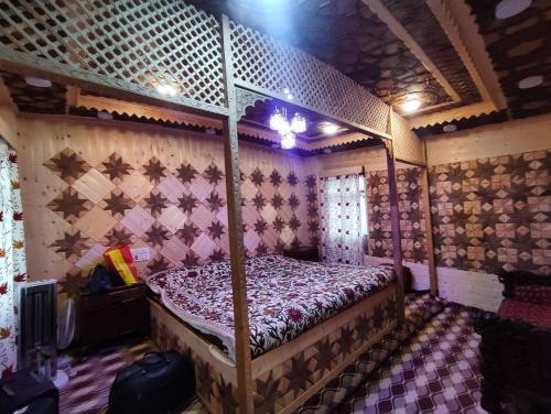 a bedroom with a canopy bed in a room at Houseboat in Ameerpet