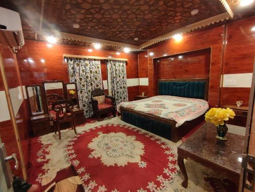 a bedroom with a bed and a red rug at Houseboat in Ameerpet