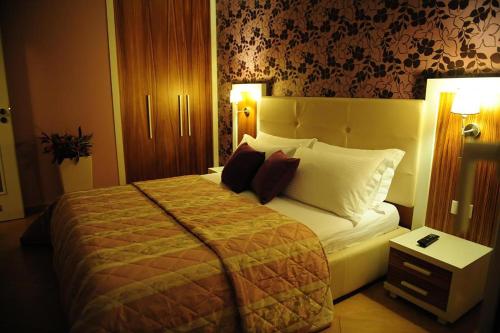 Ένα ή περισσότερα κρεβάτια σε δωμάτιο στο Hotel Gold