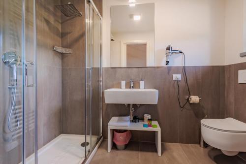 a bathroom with a shower and a sink and a toilet at Podere La Doccia in Civitella in Val di Chiana
