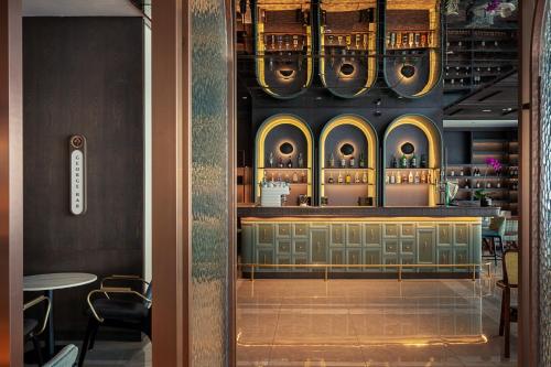 a view of a bar in a restaurant at The George Penang by The Crest Collection in George Town