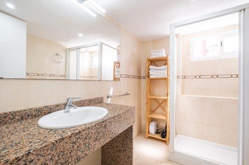 a bathroom with a sink and a shower at Torre Yago Apartment 15-2 Levante Beach in Benidorm