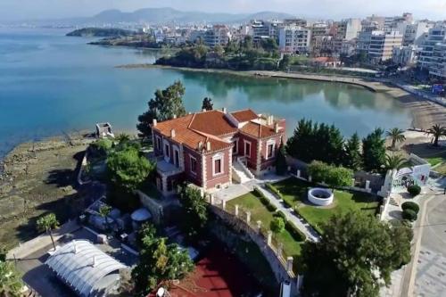 an aerial view of a house on a island in a lake at Villa Leon in Chalkida