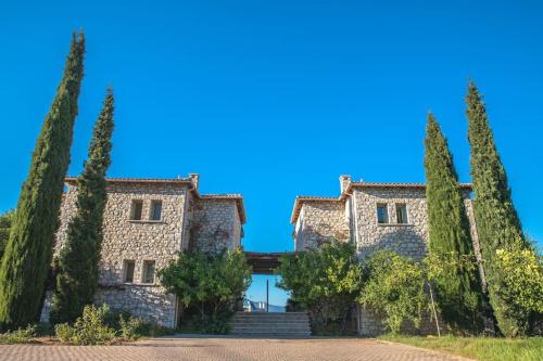 a large stone building with trees in front of it at Villa Leon in Chalkida