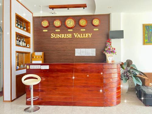a restaurant with a sun rise valley sign on the wall at Sunrise Valley Dalat Hotel in Da Lat