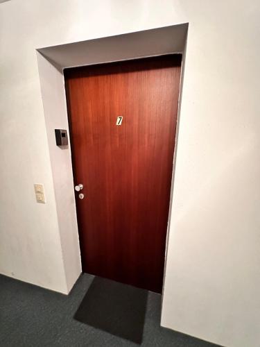 a wooden door in a hallway in a building at Wandertraum im Zentrum Bad Aussee in Bad Aussee