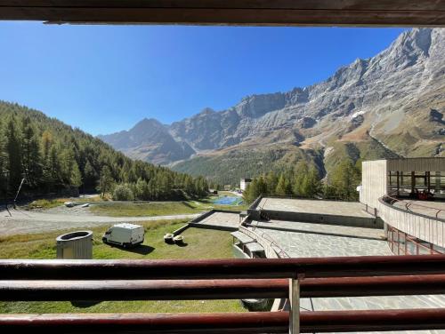 a view of a mountain range from a balcony at Cervinia Sky & Ski in Breuil-Cervinia