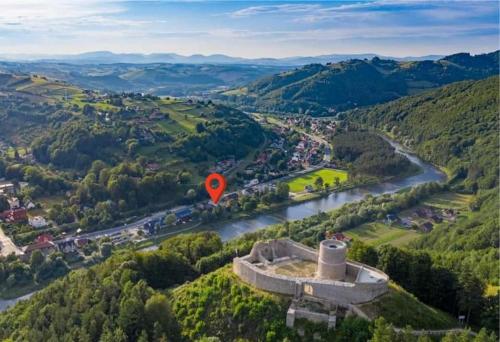 an aerial view of a river with a red marker at Apartamenty „Nad Popradem” in Rytro