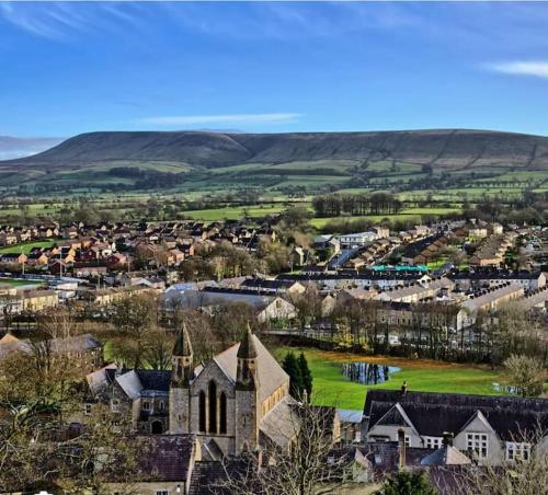 an aerial view of a small town with a church at Castle View House in Clitheroe