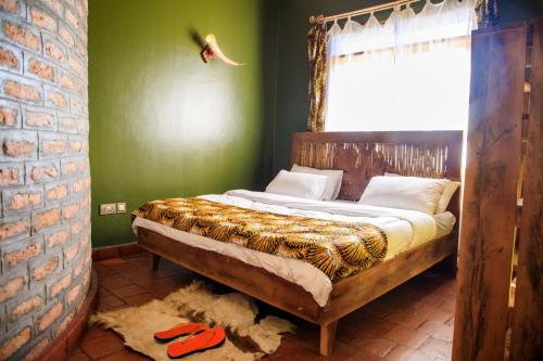 Krevet ili kreveti u jedinici u okviru objekta Apuuli Safaris and Cottages