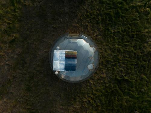 an overhead view of a soccer ball on the grass at Aurora Igloo in Hella