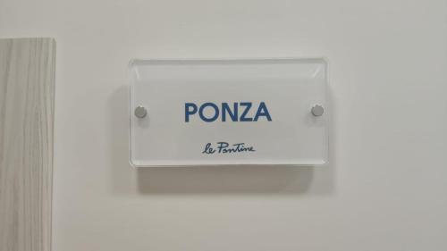 a sign that reads pomega be patient at B&B le Pontine in Gaeta