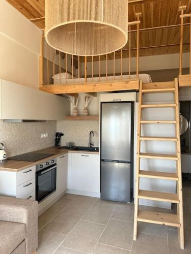 a kitchen with a loft bed in a kitchen at Harma Apartment in Léntas