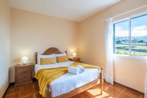 Giường trong phòng chung tại Villa Pequenino by GALMI