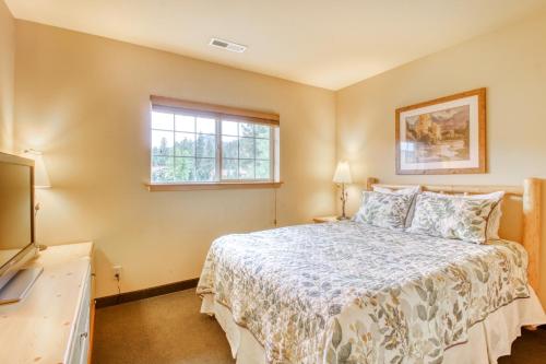 a bedroom with a bed and a window at Icicle Village Resort 507: Alpenglow Condo in Leavenworth