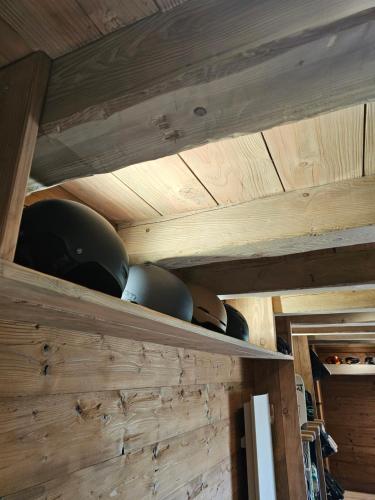 a shelf in a kitchen with pots and pans at La ferme de Jouane in Besse-et-Saint-Anastaise