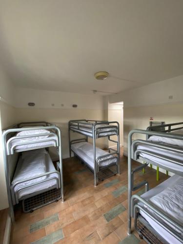 a room with four bunk beds in a room at Gogartys Temple Bar Hostel in Dublin