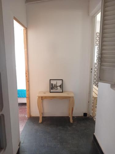 a table in the corner of a room at Hostel San Rafael - Bed & Breakfast in San Rafael