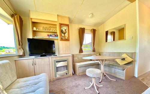 TV a/nebo společenská místnost v ubytování Rose Corner