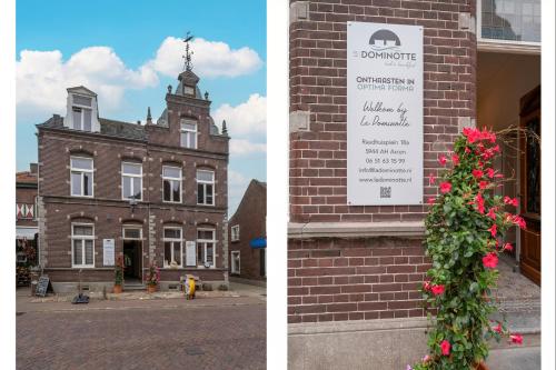 a brick building with a sign and a christmas tree at La Dominotte Arcen in Arcen
