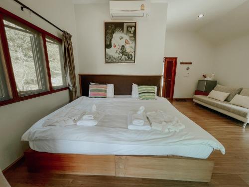 Ένα ή περισσότερα κρεβάτια σε δωμάτιο στο Tippaya Villa