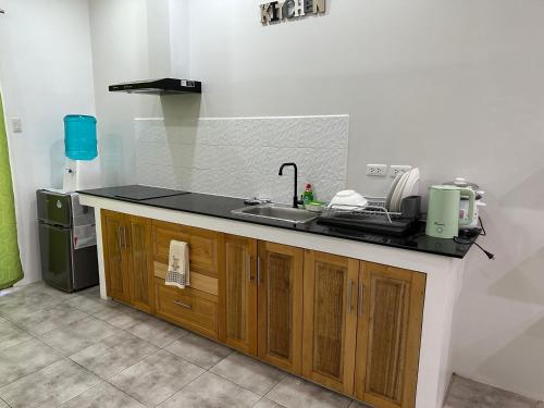 a kitchen with a sink and a counter top at Panglao Bamboo Oasis in Panglao