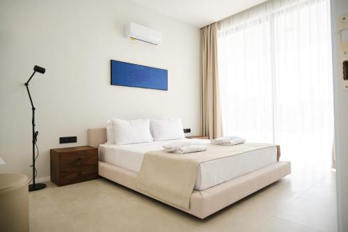 Кровать или кровати в номере Ashta Nordic Suite