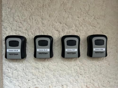 a group of four computer keys sitting on a floor at Gästehaus Trockau in Pegnitz