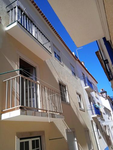 a building with balconies on the side of it at Inviting 2-Bed Apartment in Nazare in Nazaré