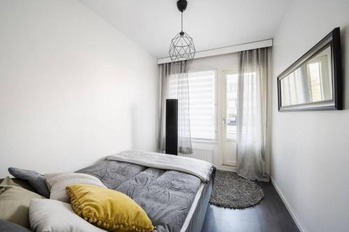 Postel nebo postele na pokoji v ubytování Huoneisto Turun keskustassa