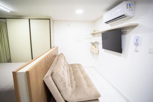 a waiting room with a couch in a room at Unity Beira Mar de João Pessoa by Carpediem in Penha