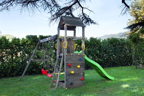 a playground with a ladder and a slide at Villa Lucini 1886 "La Dolcevita" Cottage 2, close to Lake Como and Milan in Calco