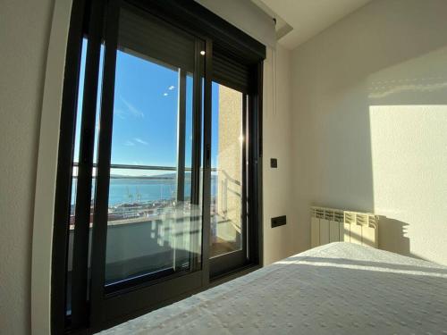Ένα ή περισσότερα κρεβάτια σε δωμάτιο στο Apartamento con vistas en Vigo by RSH