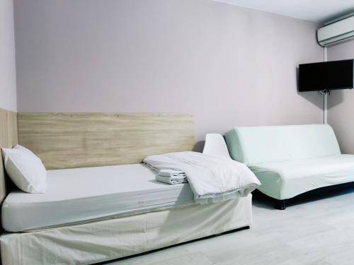 Una cama o camas en una habitación de HOTEL PLEVEN