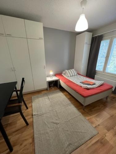 Кровать или кровати в номере Apartment Kuntatie 3