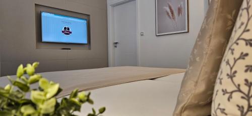 a hospital room with a bed and a television at Apartment Holata 201 in Hradec Králové