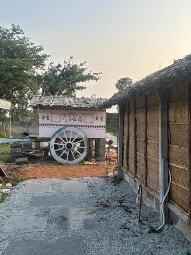 a building with a cannon next to a building at The Gravity Cafe -A Unit Of StayChillHampi in New Hampi