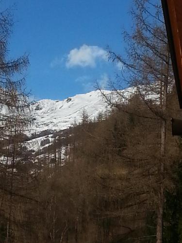 a view of a snow covered mountain from a window at Miehl in Heiligenblut