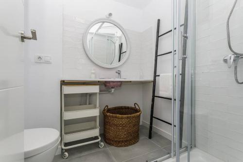 a bathroom with a sink and a mirror at Apto. primera línea playa, Retamar, Cabo de Gata (1º) in Retamar