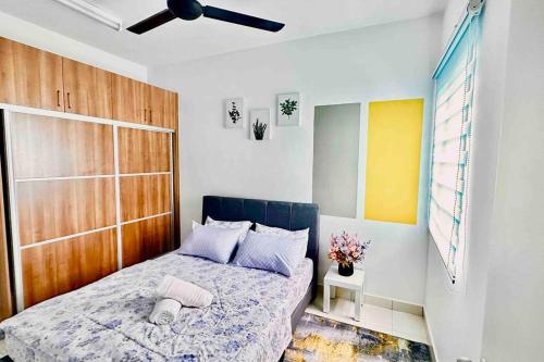 a bedroom with a bed and a ceiling fan at AF Homestay 2 Bedrooms 15mins to KLIA Free Wifi Netflix in Sepang