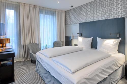 Cama o camas de una habitación en Hotel am Ochsentor