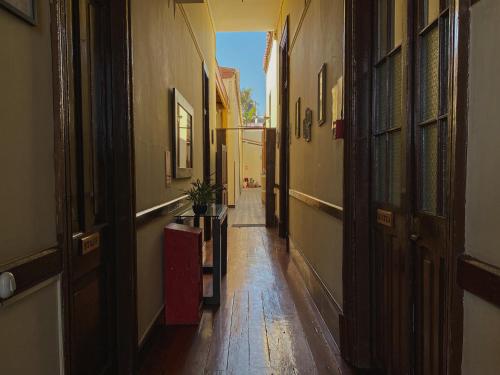 an empty hallway of an alley with a table at Villa La Punta in Lima